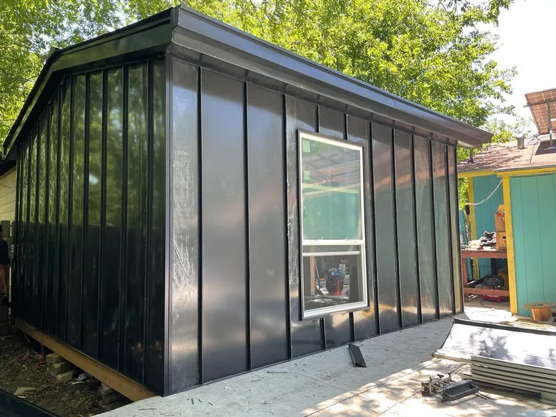 Black standing seam metal wall panels for Roof Inspection in Roselle